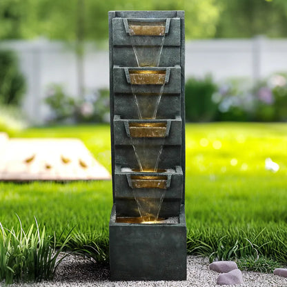 Majestic 79-inch tall natural stone outdoor water feature standing proudly on a green lawn