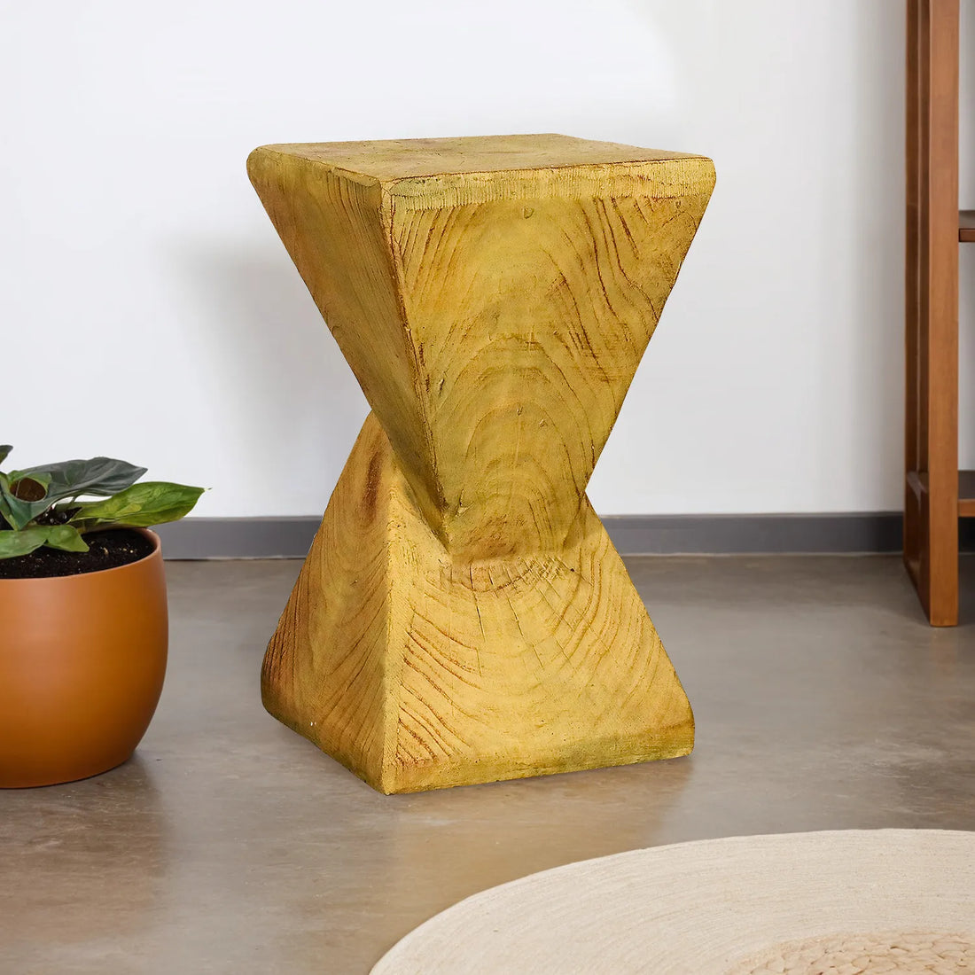 Modern 19.6-inch pyramid pedestal end table in golden yellow in a minimalist indoor living room.