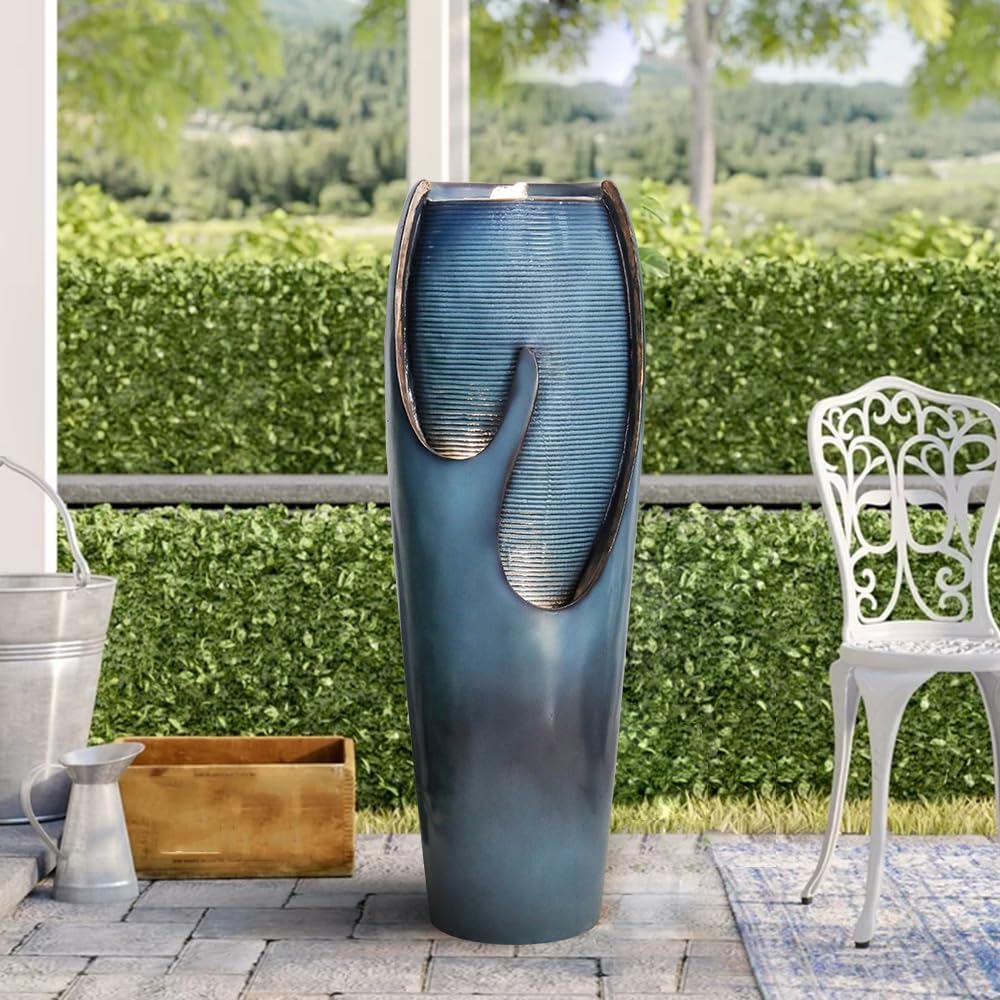 Modern curved jar water feature placed elegantly next to an outdoor wooden gate fence
