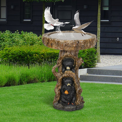 Multiple wild birds, including a flying dove, gathering to drink and feed at the two-bear outdoor bird bath.