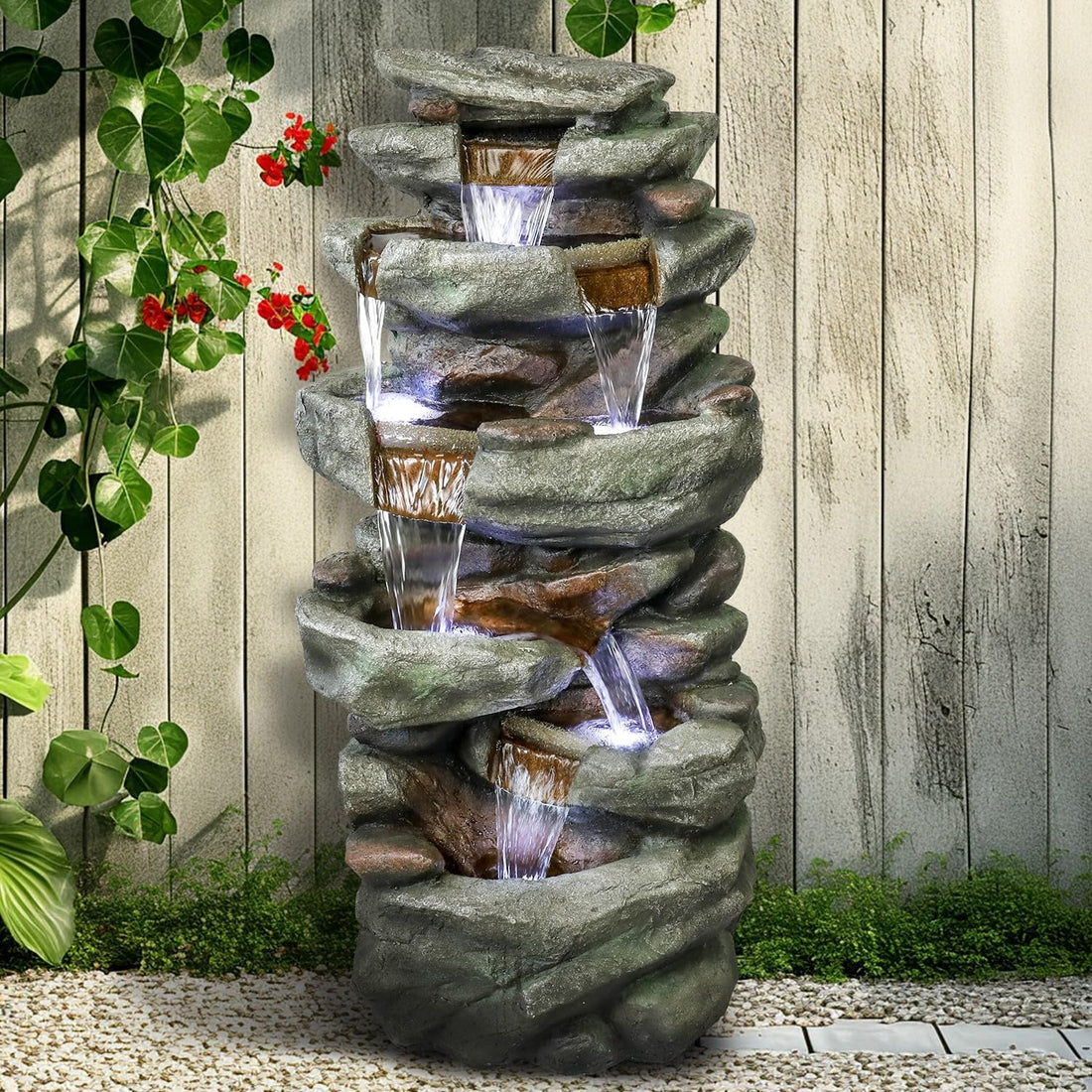 Natural-looking outdoor stone fountain positioned at the front door for a welcoming entrance