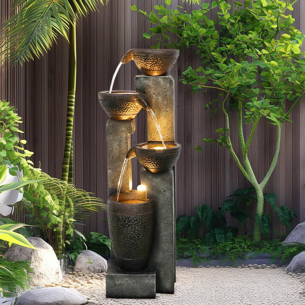 Outdoor floor fountain with warm LED lights creating a peaceful backyard retreat