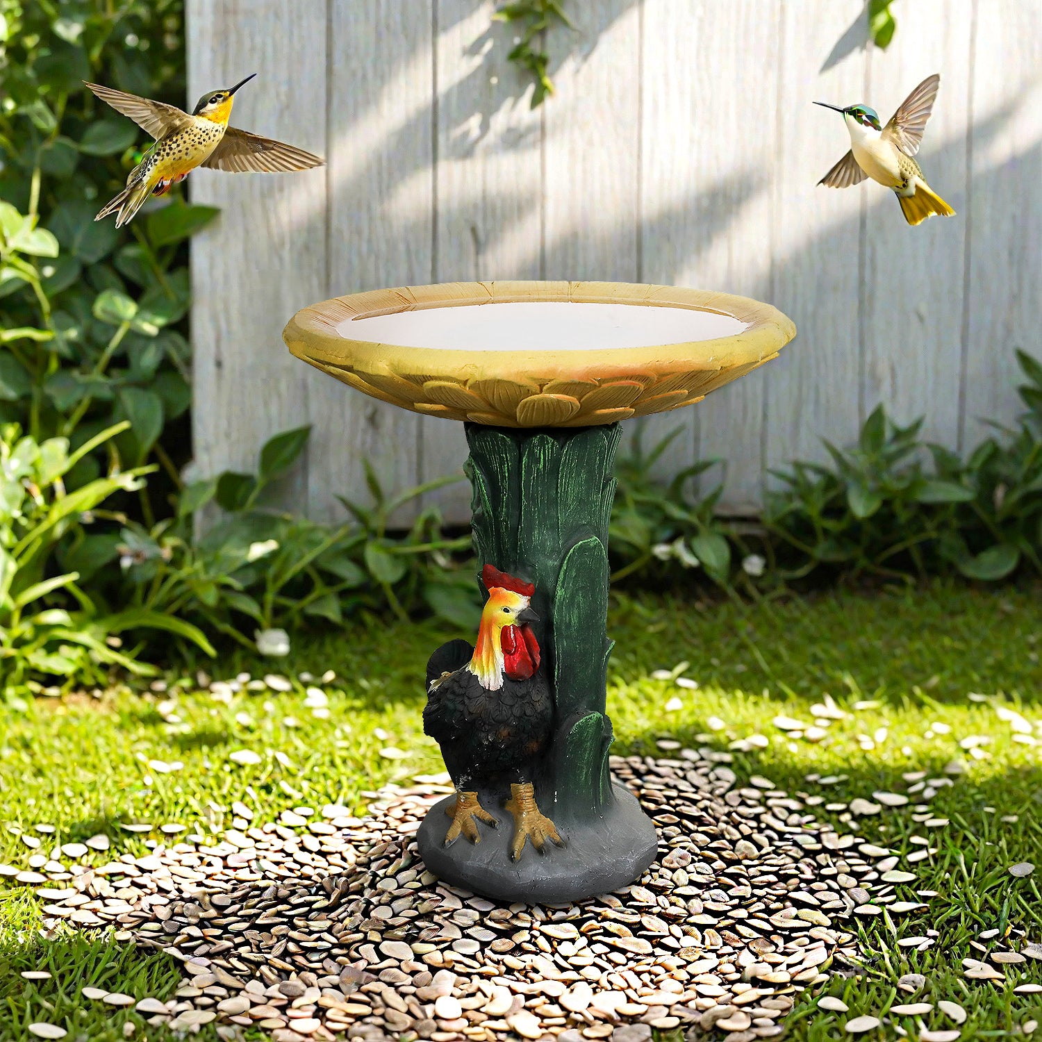 Outdoor scene of the rustic sunflower concrete bird bath decorating a backyard patio.
