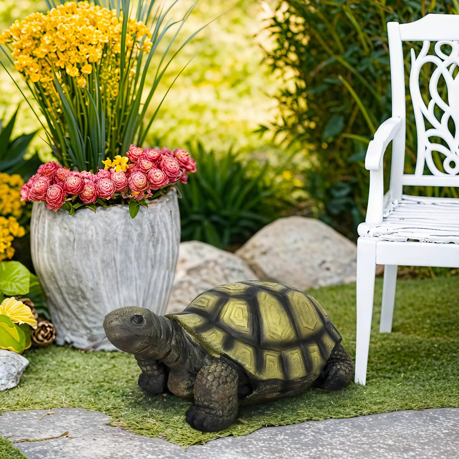 Realistic tortoise garden ornament nestled among flowers in a backyard landscaping project.