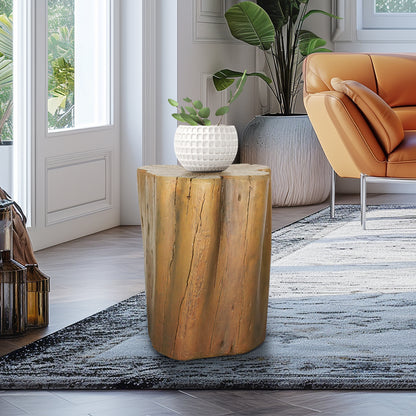 Rustic outdoor side table made of concrete placed next to a patio chair.