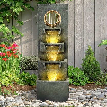Tall square water feature positioned against a modern fence for an artistic look