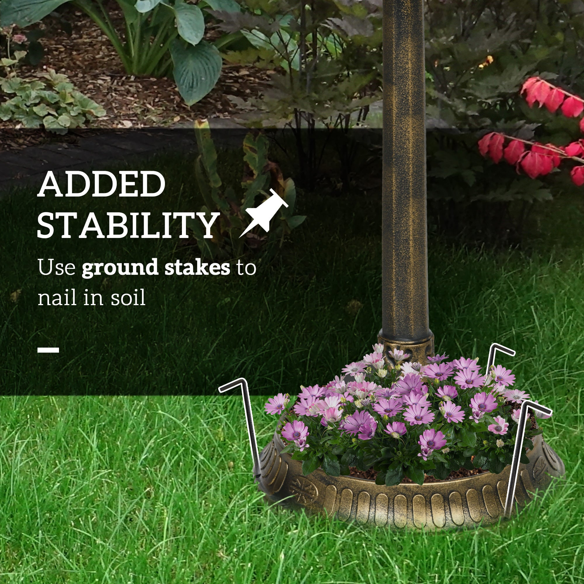 bird bath anchored with ground stakes on lawn for added stability