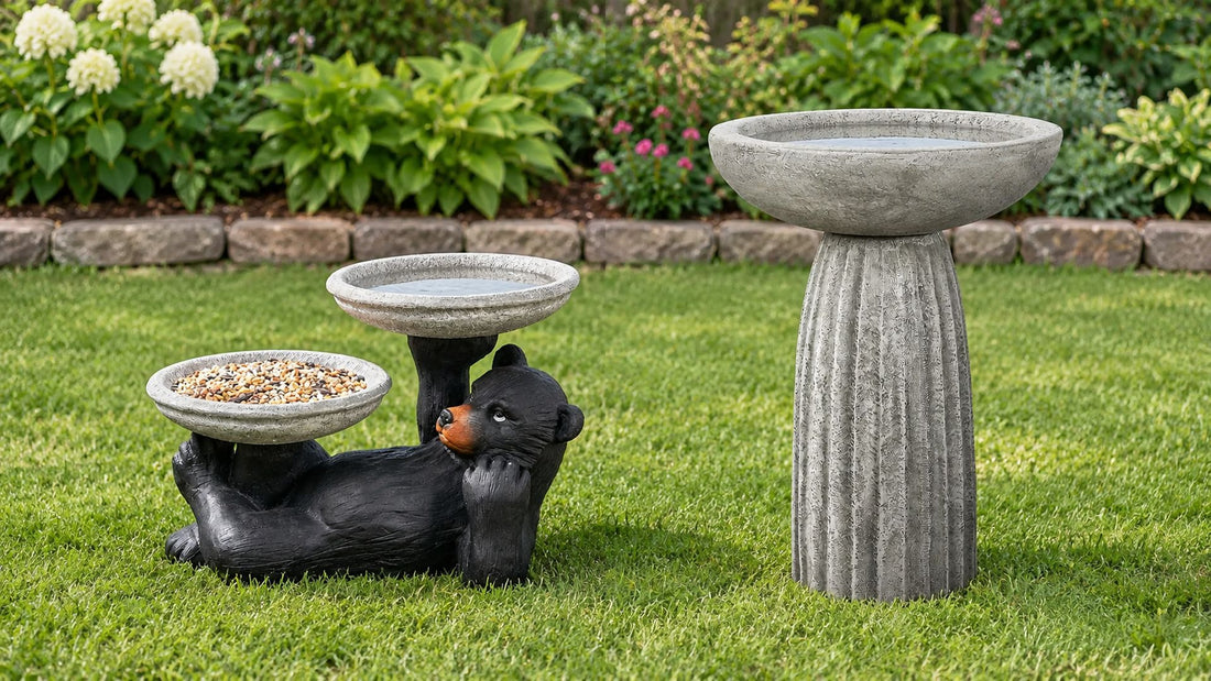 A low bear feeder bird bath beside a tall fluted pedestal bird bath on a lawn showing the height difference