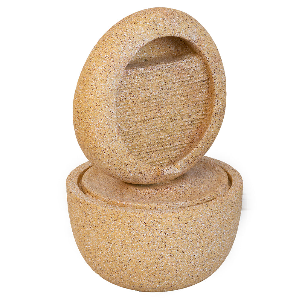 Cream concrete ring fountain angle view showing the ribbed panel and bowl base