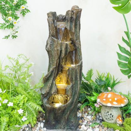 Resin Tree Trunk Outdoor Fountain 39 Inch in garden setting