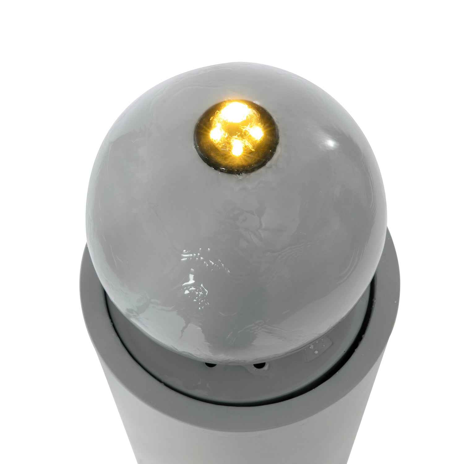 closeup of small gold finial on sphere top of the fountain