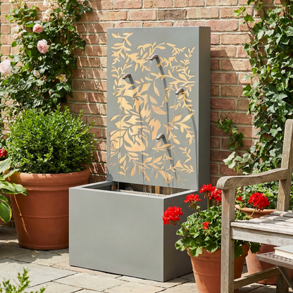 leaf wall cascade fountain surrounded by garden greenery and potted flowers