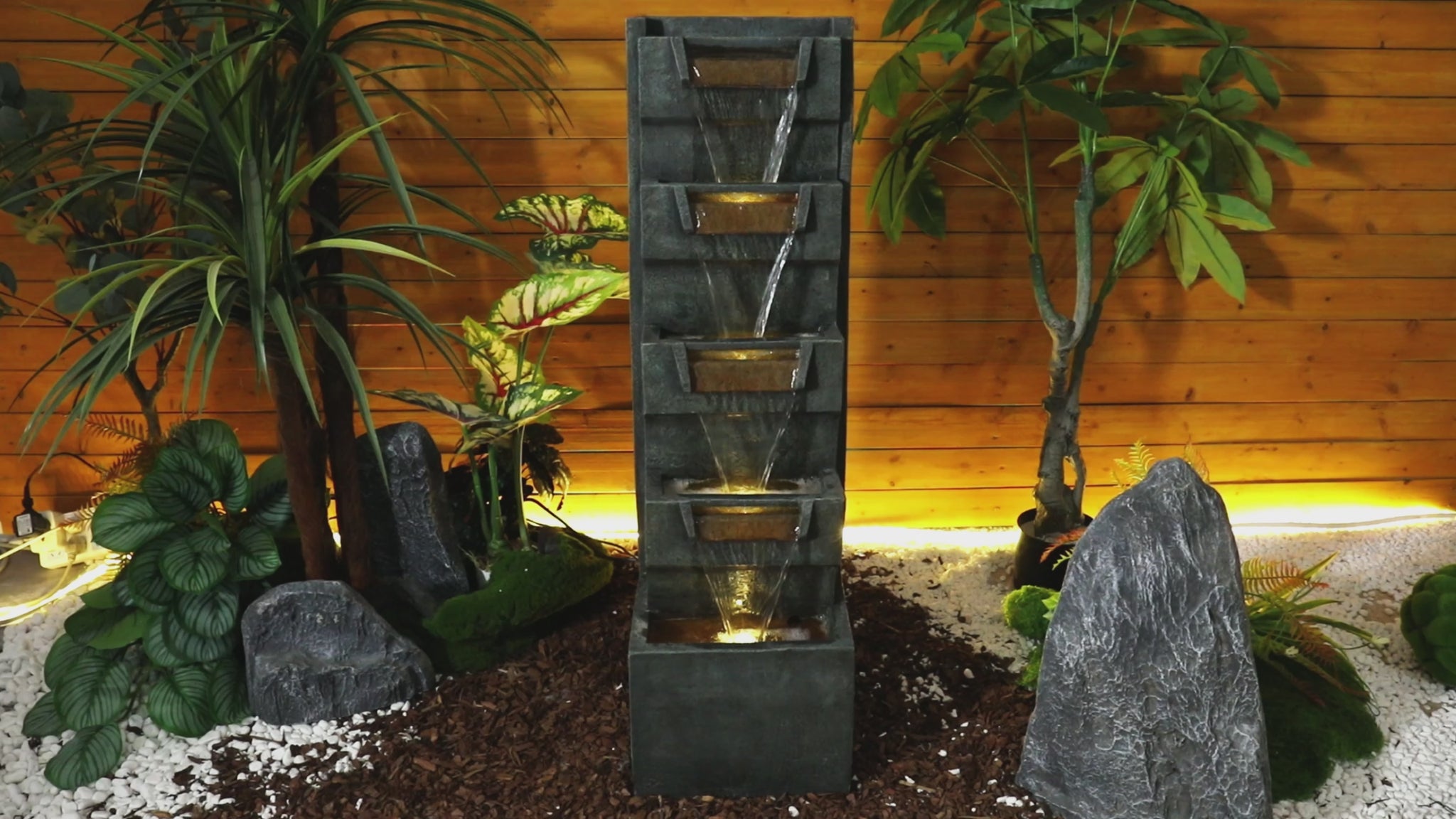 Video showing the powerful cascading water flow and radiant night lights of the 79 rock fountain.

