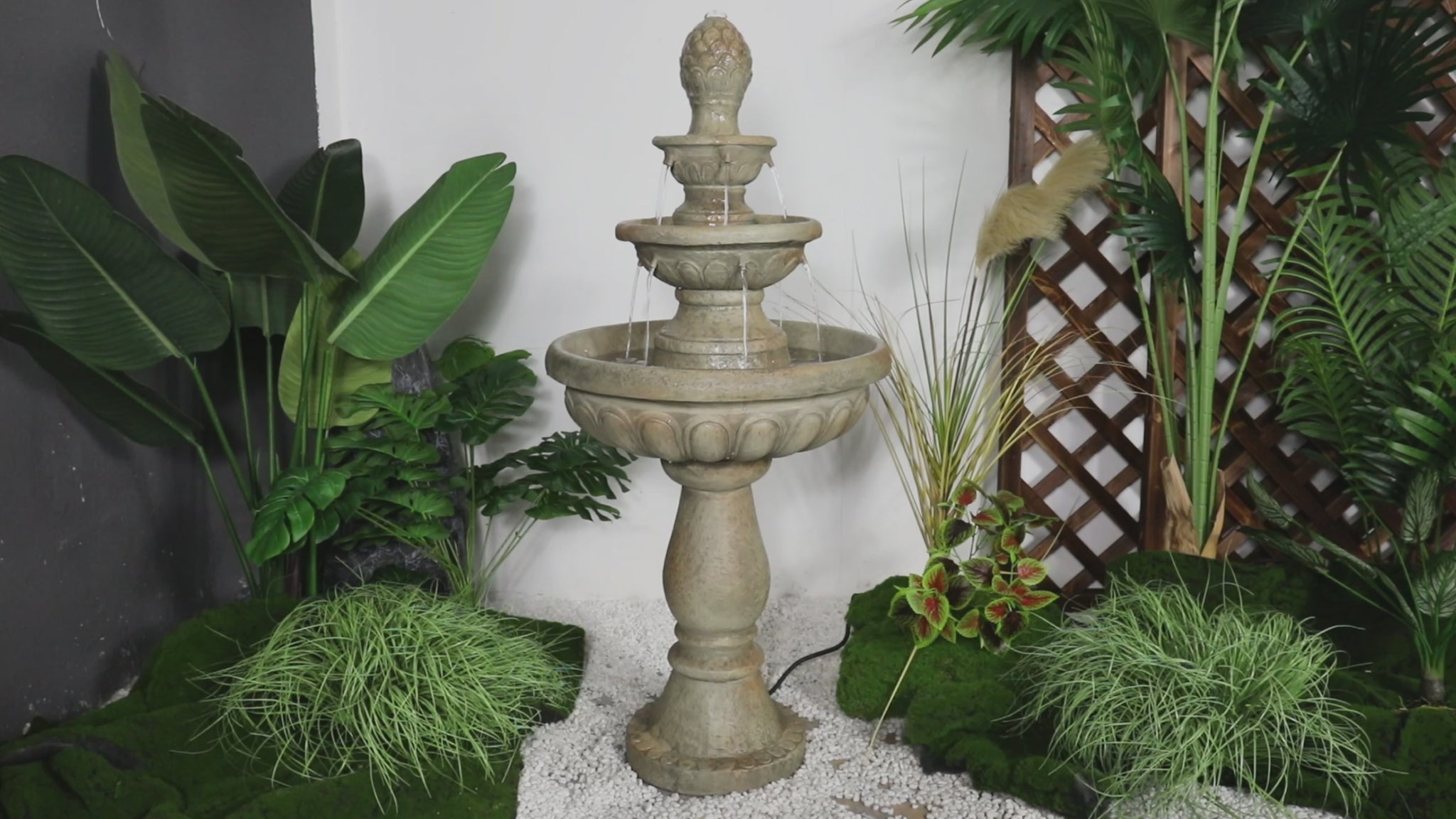 Video showing the soothing cascading water flow of the 3-tier pineapple finial garden fountain.