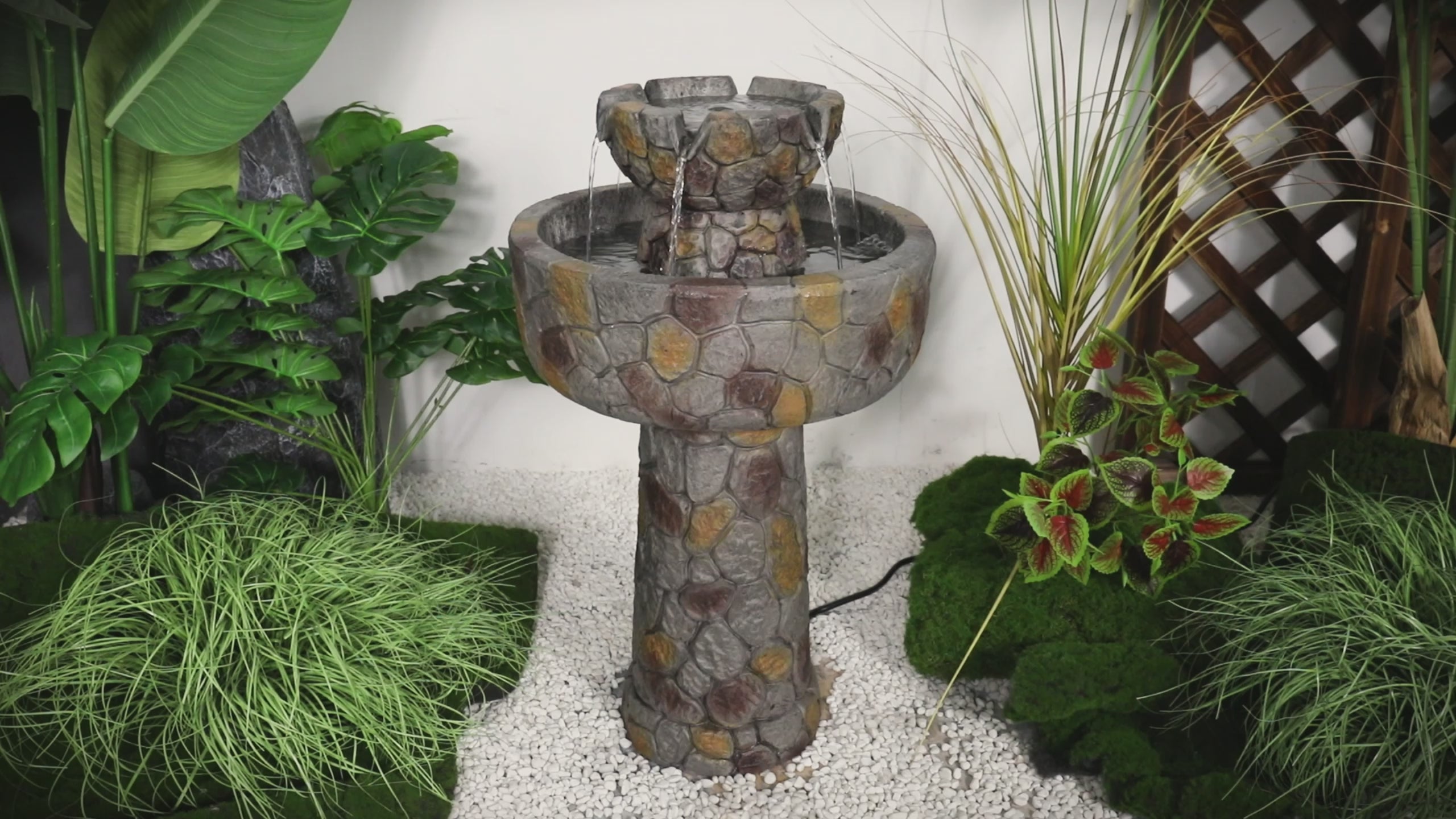 Video showing the soothing bubbling water and rhythmic cascading flow of the concrete bird bath fountain.
