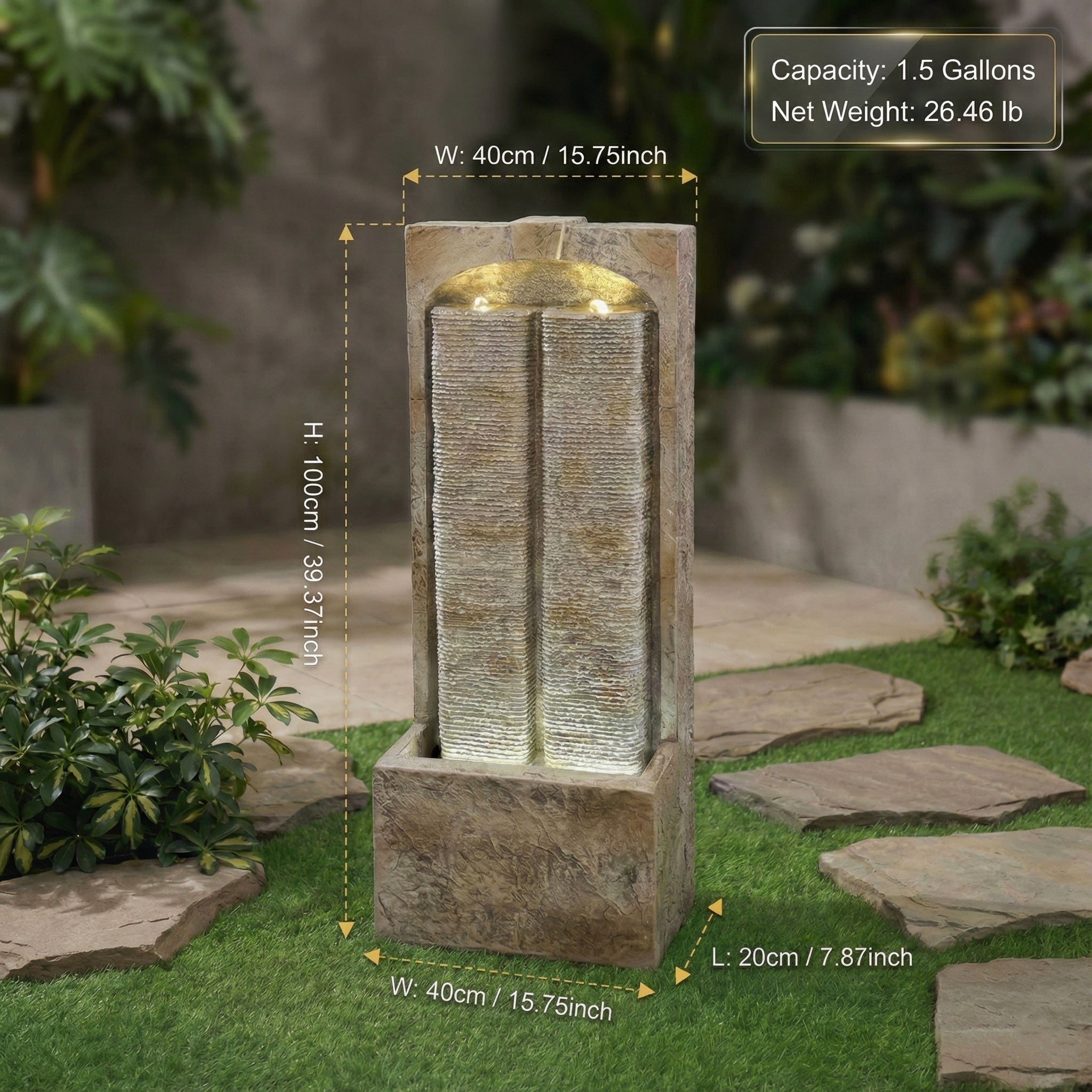 split sandstone column fountain lit at dusk along a garden path