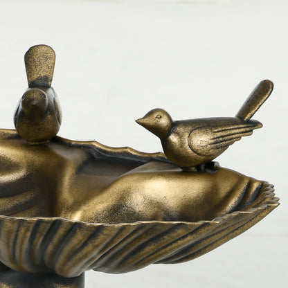 twin sculpted songbirds on shell basin detail of antique bronze bird bath