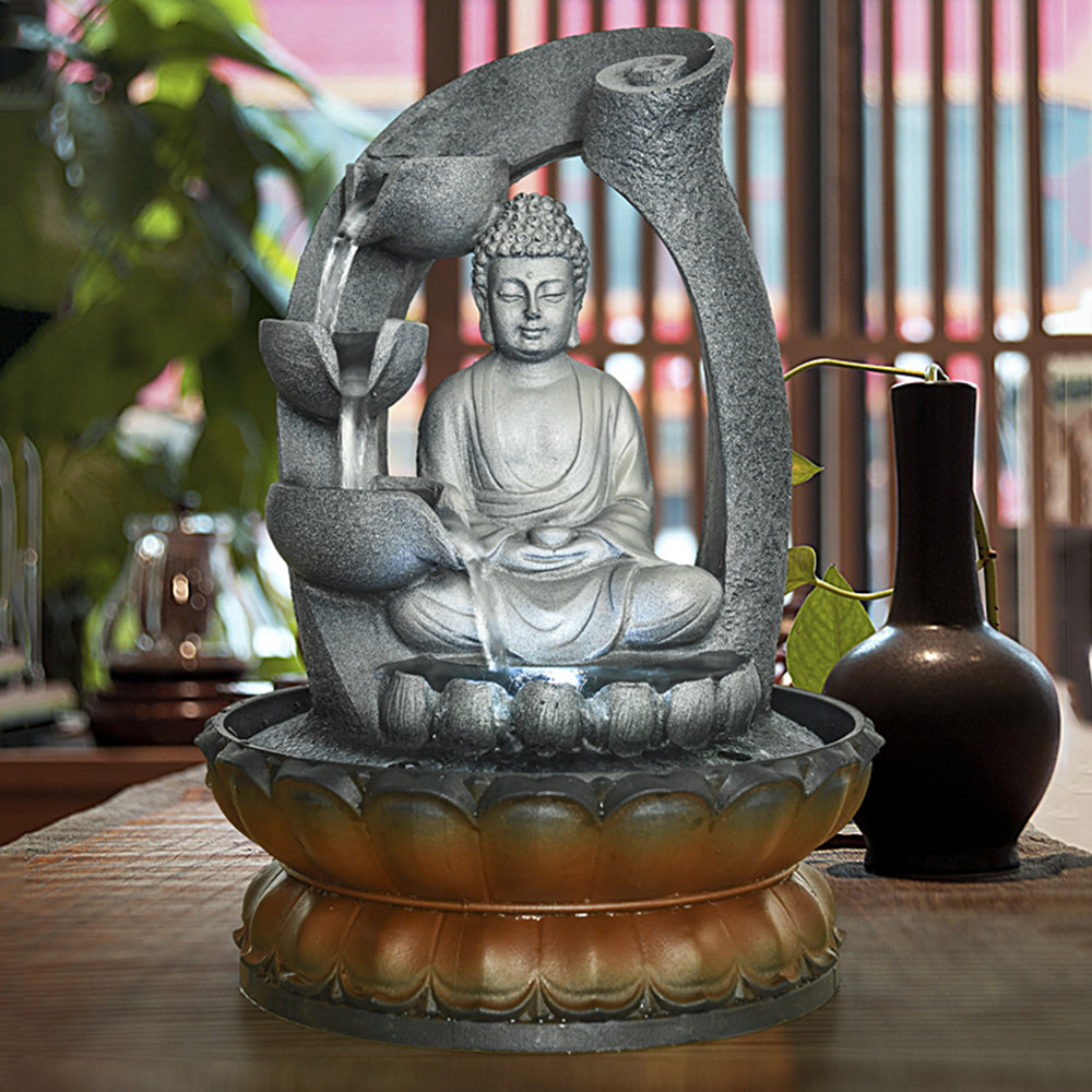 11"H Zen Buddha tabletop fountain creating a serene atmosphere in an indoor meditation room