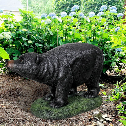 25.5"L realistic black bear garden statue standing proudly on a vibrant green lawn