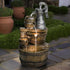 25.5" tall retro barrel fountain tucked into a cozy rustic garden