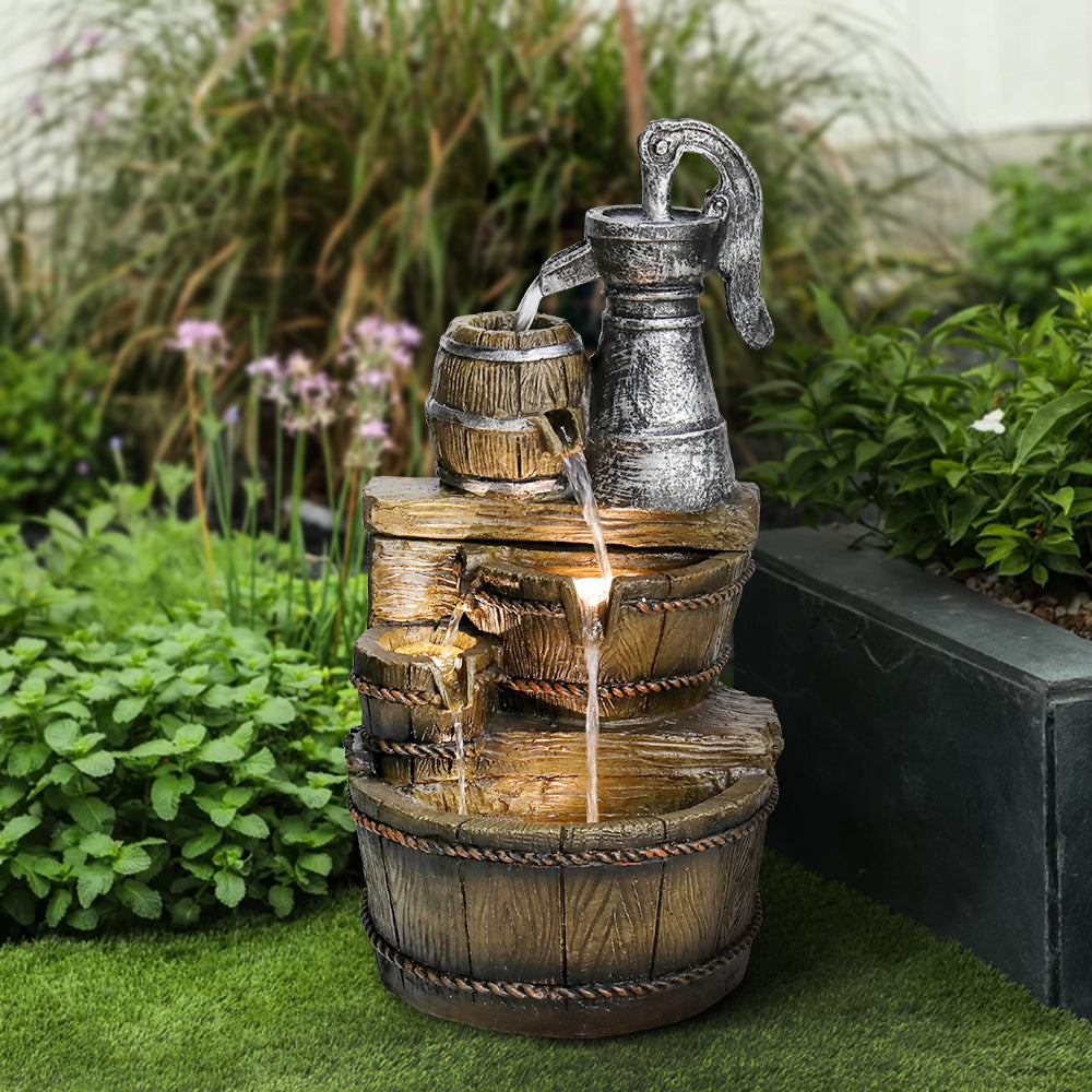 3-tier broken well outdoor water feature on a fresh green lawn