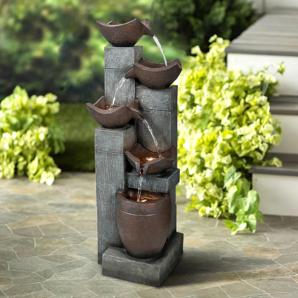 39.7"H 5-tier modern outdoor fountain greeting guests at a stylish home door entrance