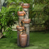 39.7 inch tall modern cascading column fountain placed in a decorative garden