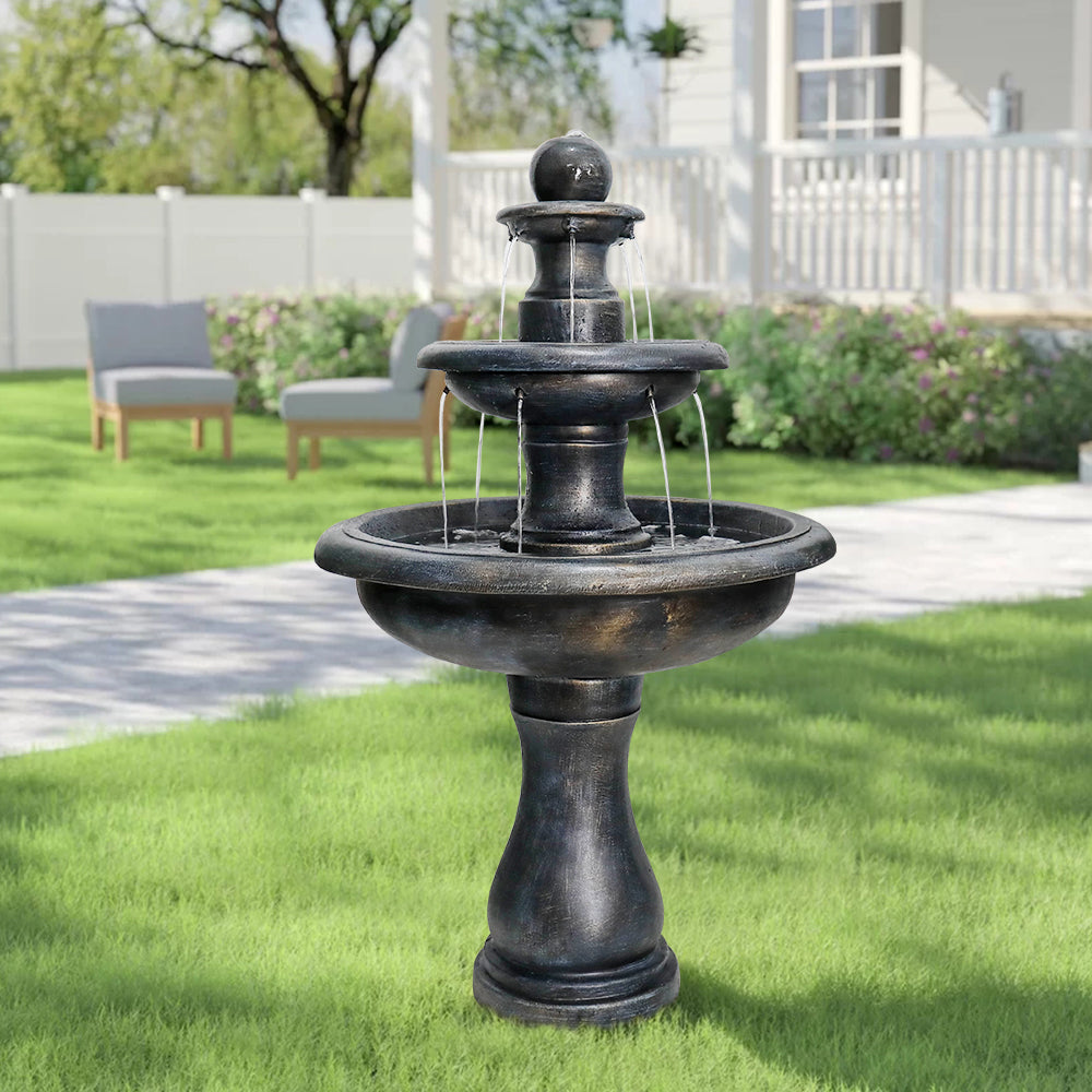 45.2" tall 3-tier antique black concrete fountain in a lush garden