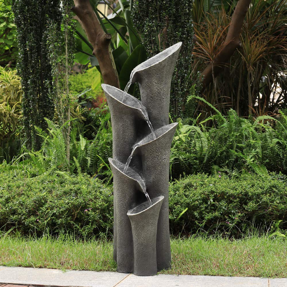 5-tier cascading waterfall blending beautifully with natural outdoor garden greenery
