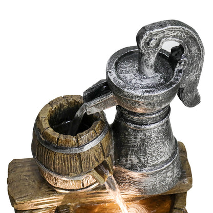 Close-up of cascading water and LED light in the rustic barrel