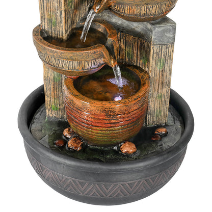 Close-up of the cascading water gathering in the LED illuminated bottom basin