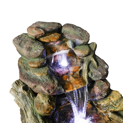 Close-up of the top aged wood tier where the soothing waterfall stream begins to cascade.