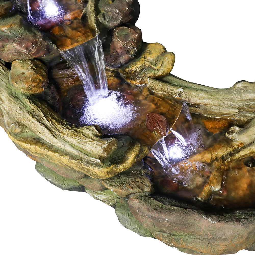 Detailed shot of the middle stone-like tiers and glowing LED lights in the creek fountain.