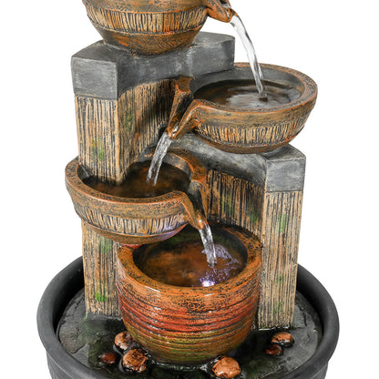 Detailed view of water gracefully cascading through the secondary antique bowls