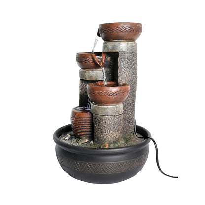 Focused view of the right side base of the fountain with the power cord trailing away.