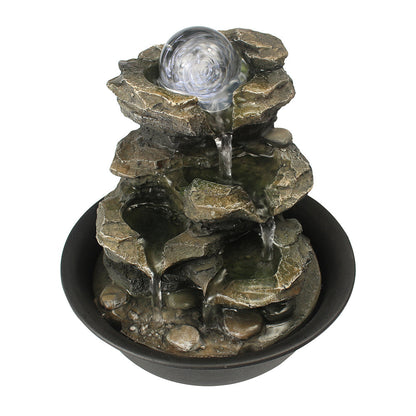 Front view of the 8.3" 4-tier rock tabletop fountain with LED crystal orb on white