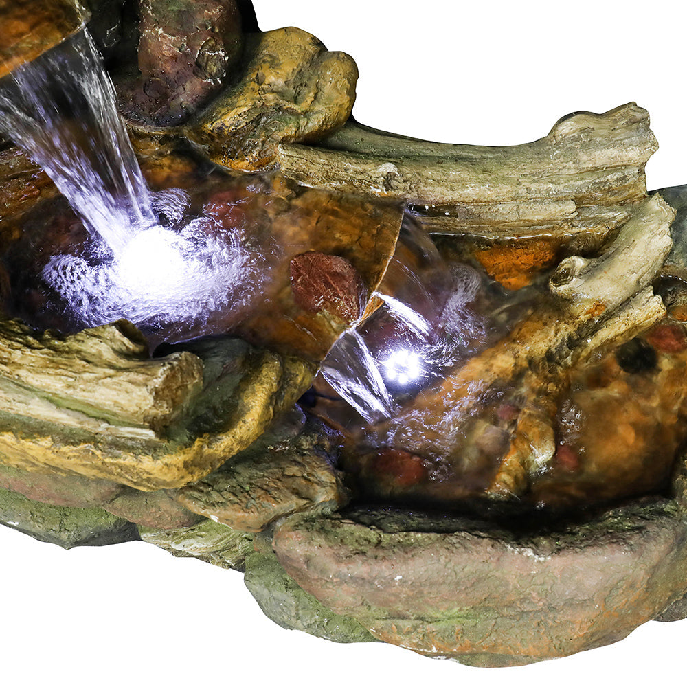 Macro view of the wide lower basin capturing the illuminated cascading water and pump area.