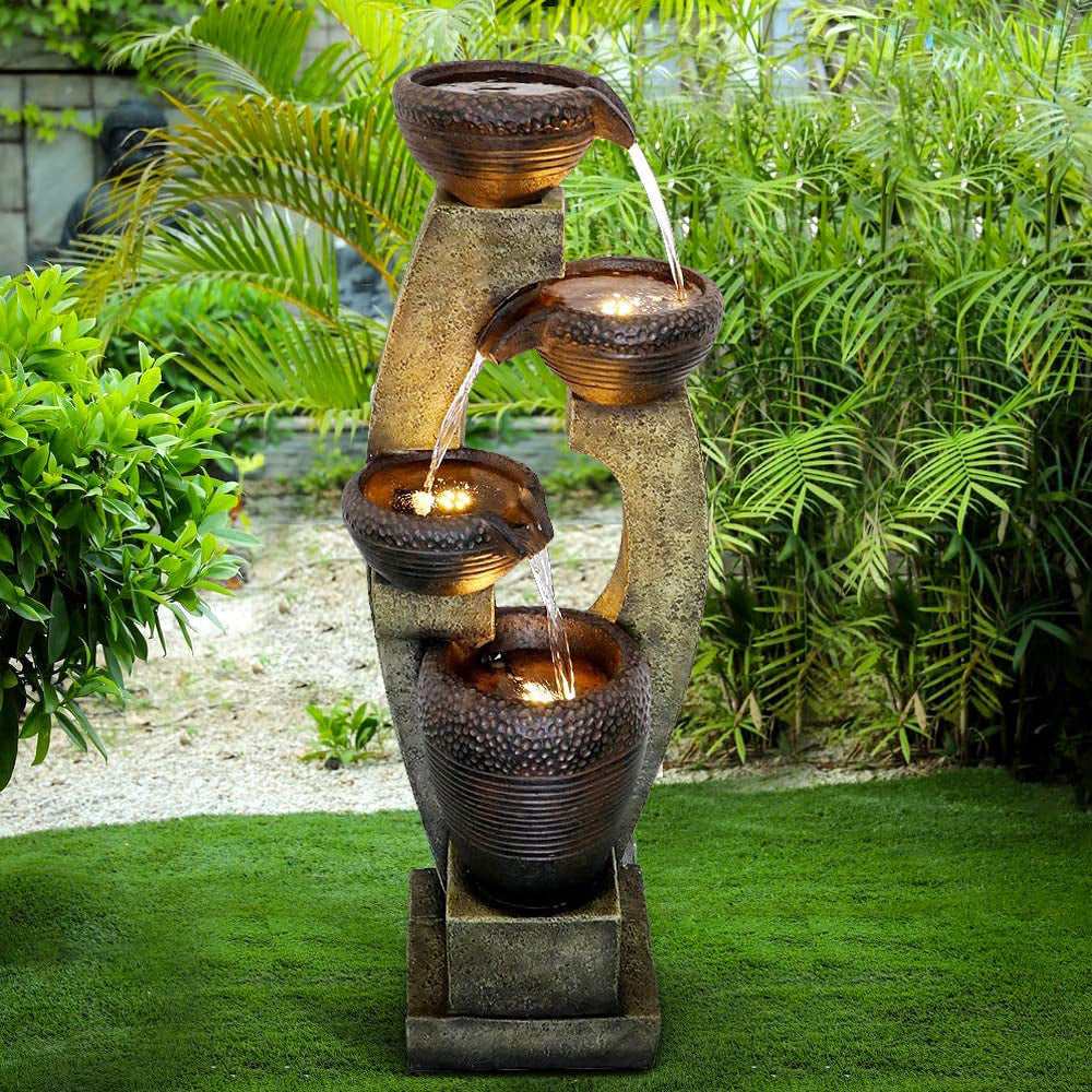 Modern cascading bowls fountain standing elegantly on a lush green lawn