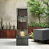 Modern dark gray cascading waterfall fountain creating a peaceful atmosphere in a lush garden