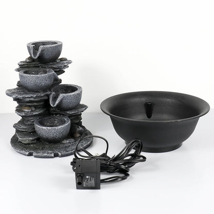 Parts display showing the resin bowls, submersible pump, and water flow components