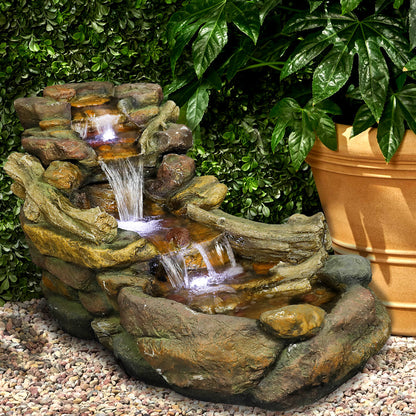 Realistic aged wood and stone outdoor fountain placed elegantly next to patio flower pots.