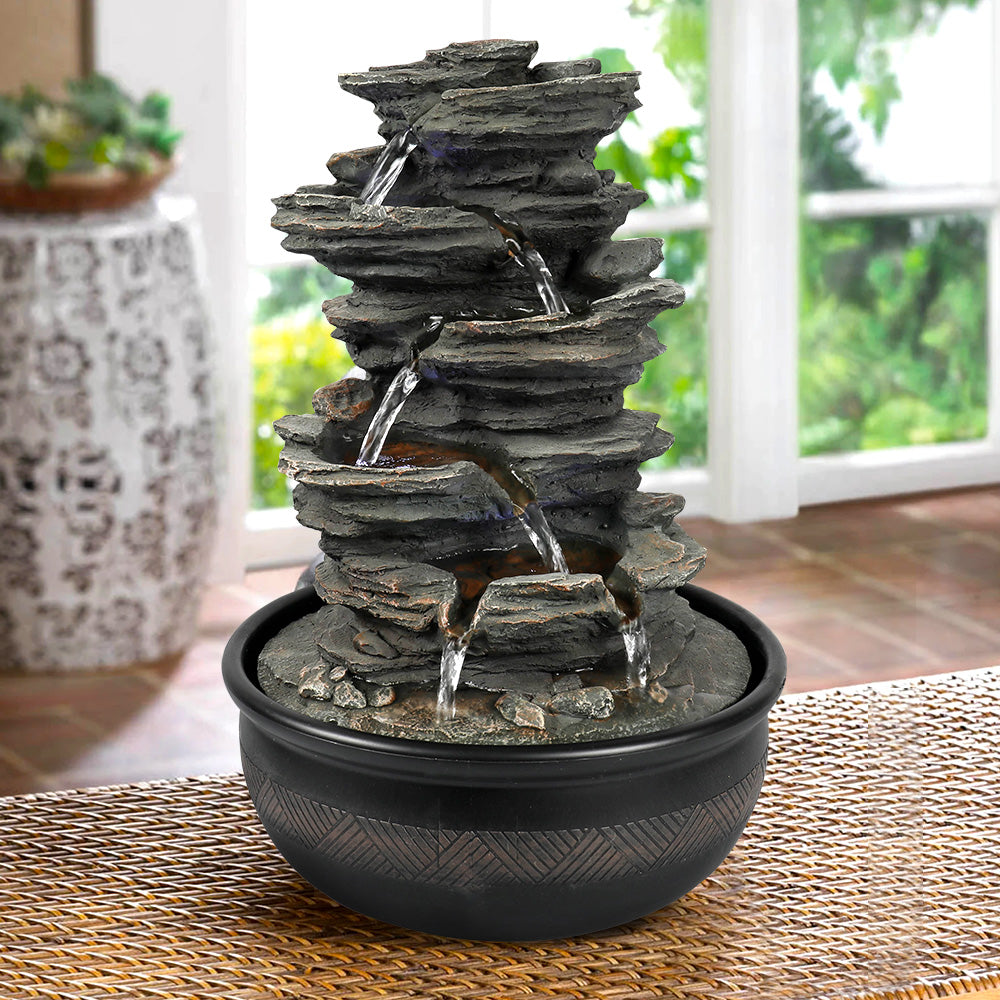 Resin 6 Tier Slate Tabletop Water Fountain 15 Inch in garden setting