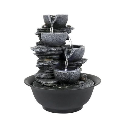 Right side view of the light gray resin cascading bowl fountain on white