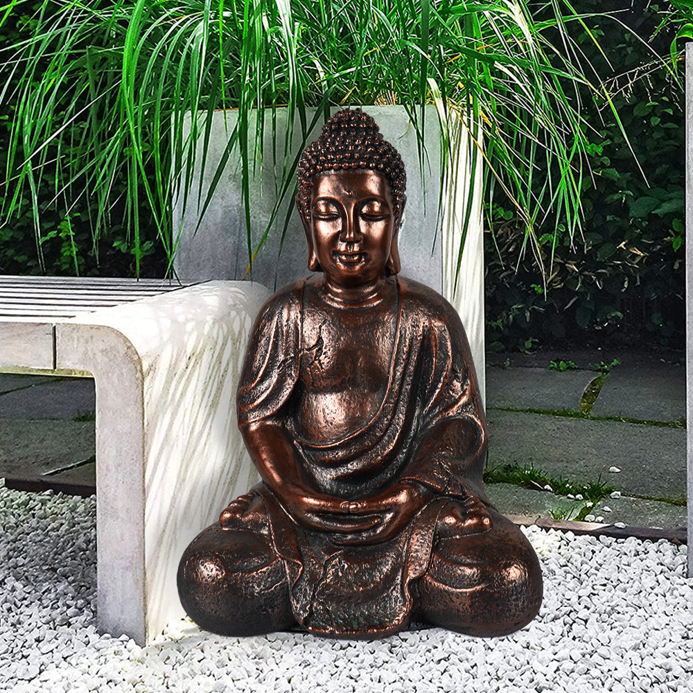 Welcoming bronze finished Buddha statue providing tranquility on a home entryway table