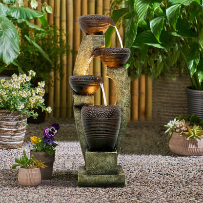 Zen outdoor water fountain with LED lights creating a relaxing ambiance in a backyard patio
